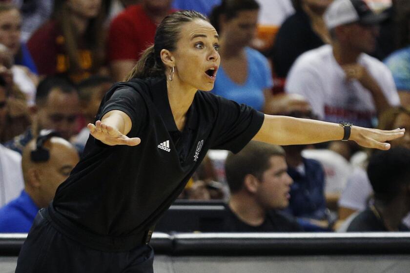 San Antonio Spurs summer league Coach Becky Hammon instructs her players during a win over the Phoenix Suns in Las Vegas on July 20.