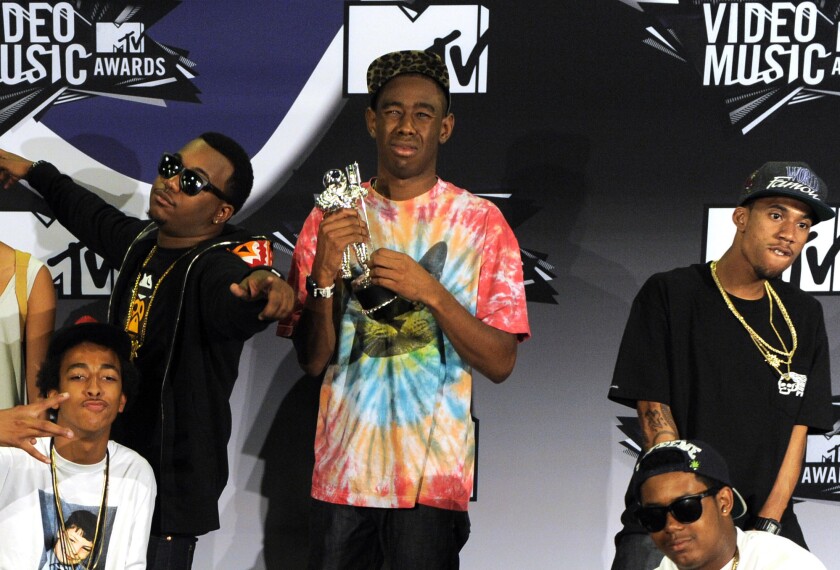 Tyler, The Creator, center, holds the award for best new artist as he poses with other members of Odd Future at the MTV Video Music Awards in Los Angeles. New Zealand immigration authorities have banned Los Angeles rappers Odd Future from entering the country after deciding they pose a threat to public order.