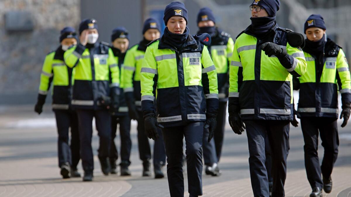 Police officers patrol a Winter Olympics venue on Feb. 10 in Pyeongchang, South Korea.