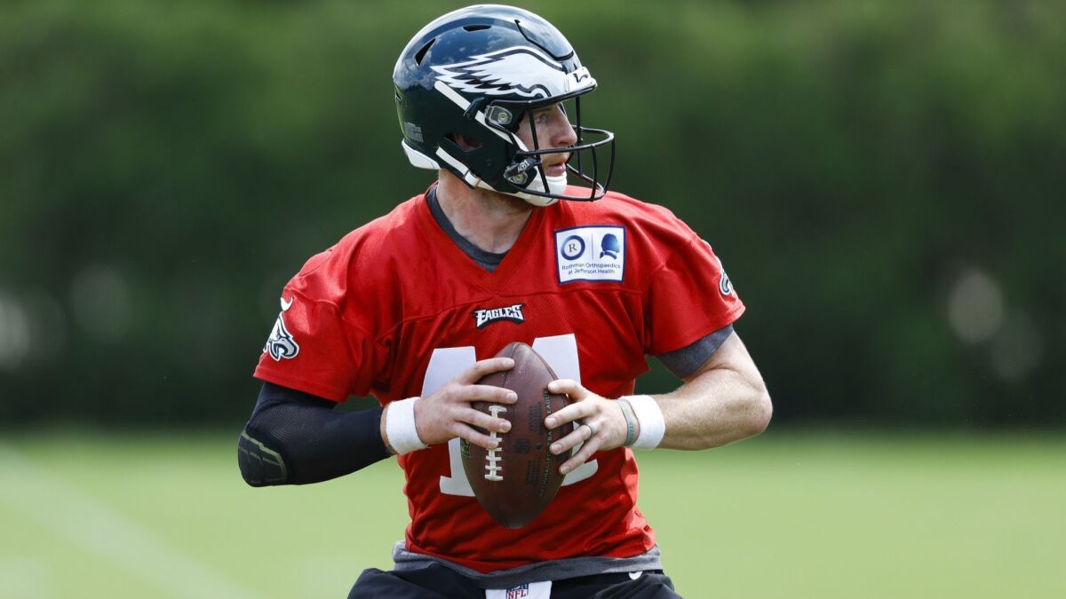 The Philadelphia Eagles’ Carson Wentz participates in a drill during organized team activities at the team’s practice facility on Monday in Philadelphia.