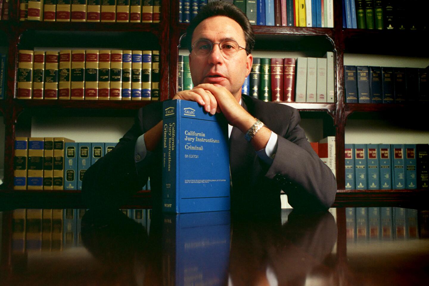 Jack Earley, one of the top criminal defense attorneys in Orange County, is shown in his Irvine law library. Among his high-profile clients is Betty Broderick.