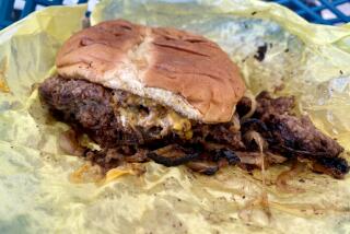 The double oxtail smash burger from The Jerk Grill in Redlands.