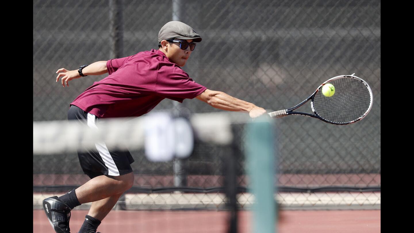 Ocean View High's Kyle Tsai competes during a No. 1 singles set against Westminster in a Golden West League match on Thursday, April 19.