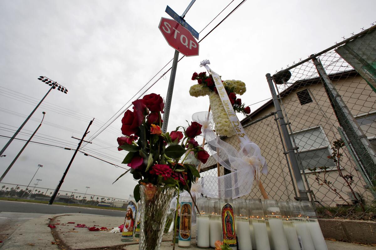 A makeshift memorial at the site of a deadly shooting in Pomona in November. Police say at least 28 people have been victims of homicides in the city this year.