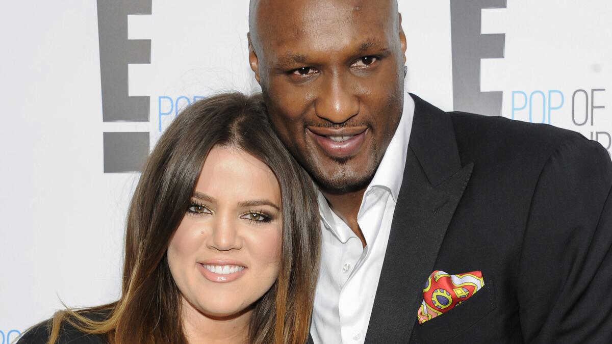 Lamar Odom, shown in 2012 with Khloe Kardashian, has reportedly taken his first steps without assistance since his October overdose.