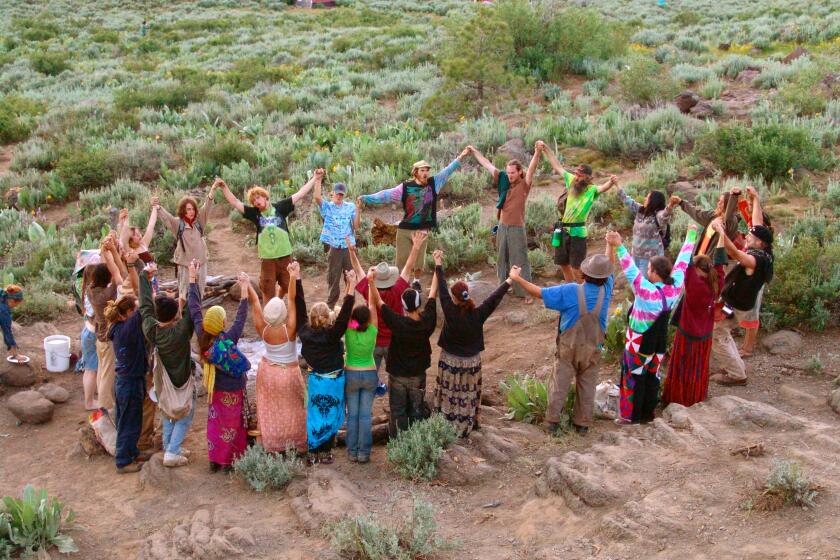 Hippies forming a Supper Circle at a US Rainbow Family Gathering.