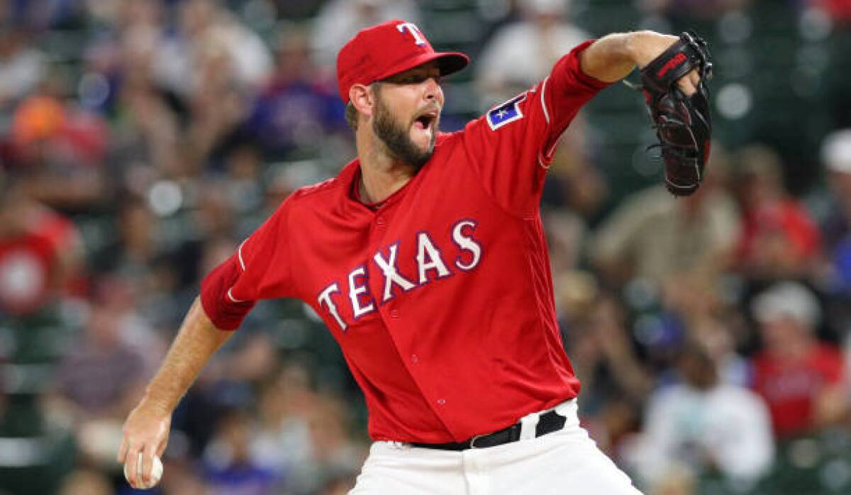 Rangers pitcher Chris Martin delivers during a game against the Angels in September 2018.