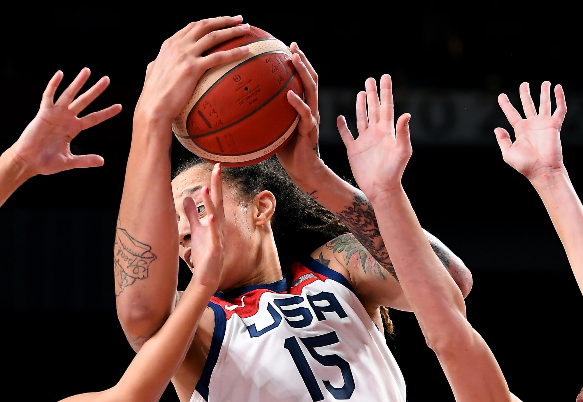 Brittney Griner of the U.S. holds the basketball at the Tokyo Olympics.