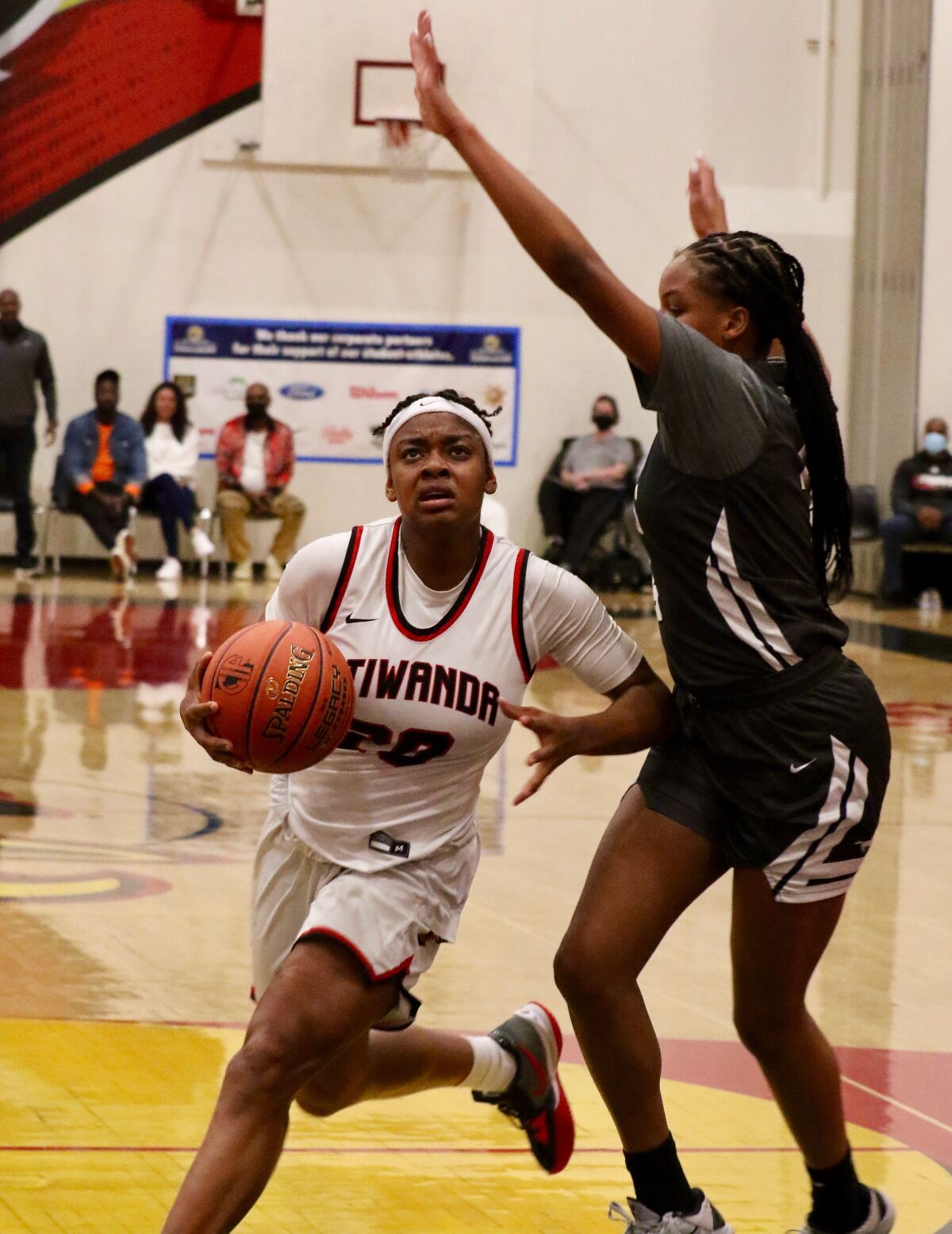 Etiwanda’s Destiny Agubata drives around Sierra Canyon's MacKenly Randolph.