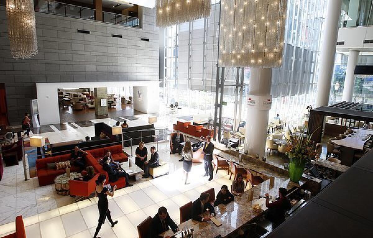 The JW Marriott Los Angeles LA Live and the Ritz-Carlton Los Angeles share a building near Staples Center. Both brands are favorites among affluent travelers, a survey finds.
