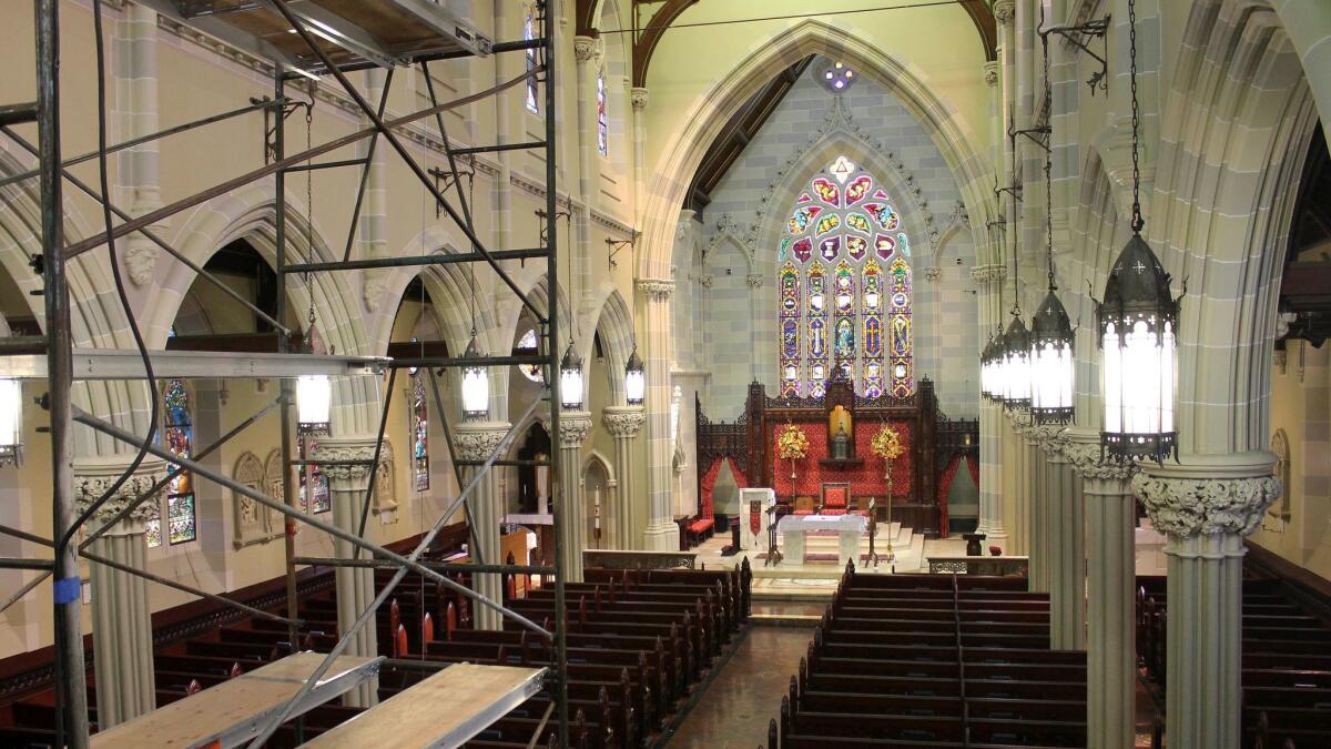 In this 2016 photo, scaffolding is used to help disassemble the organ stands in the sanctuary of St. Mary's Church in Newport, R.I. The church where John F. Kennedy and Jacqueline Bouvier married in 1953 is inviting the public to visit and learn about the wedding.