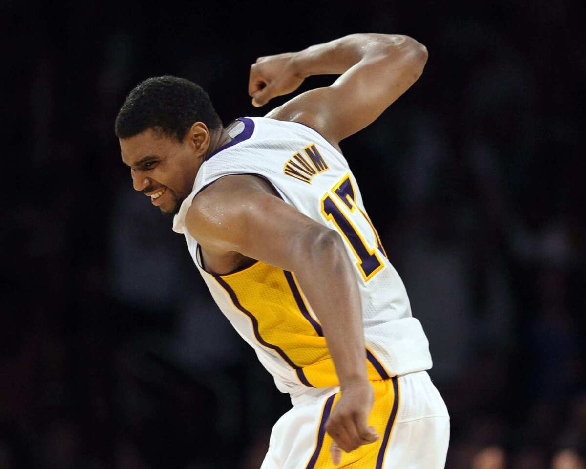 Lakers center Andrew Bynum celebrates after scoring in overtime against the Mavericks on Sunday afternoon at Staples Center.