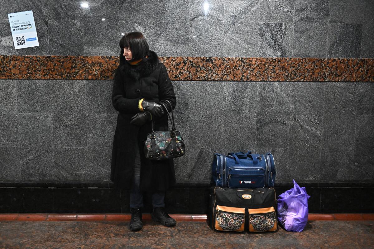 A woman in a train station.