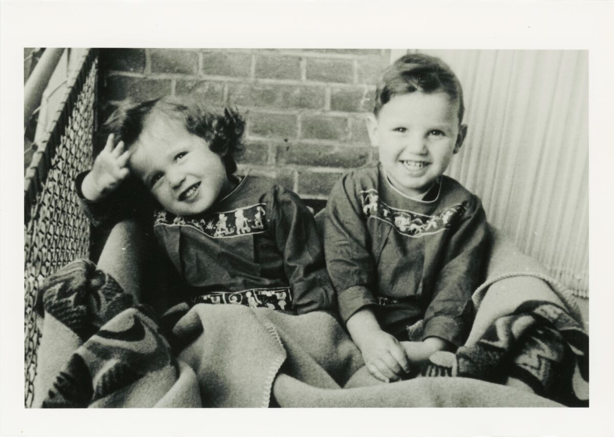 Smiling twins in a photo from 1942. 
