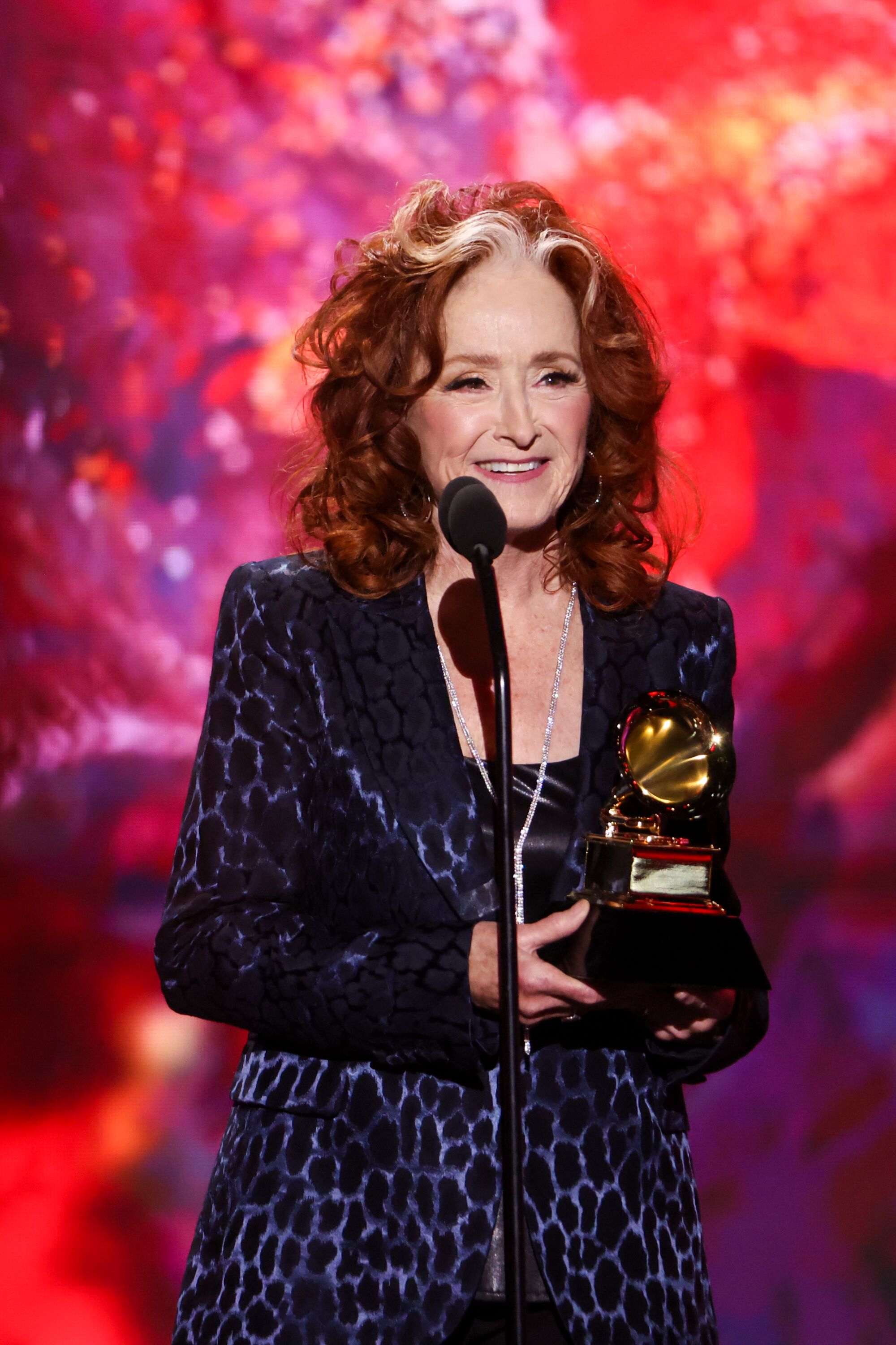 Bonnie Raitt accepts the Song of the Year award for "Just Like That" at the 65th Grammy Awards.