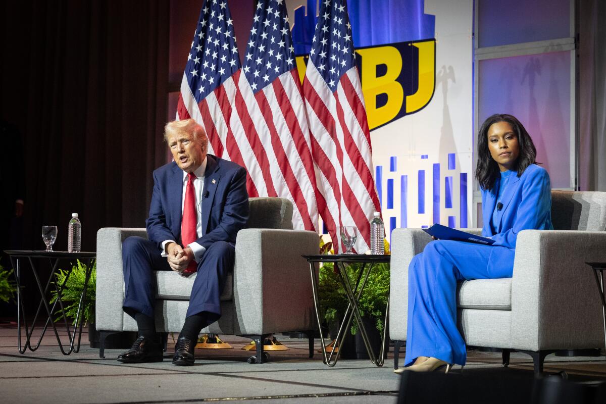 Former President Trump sits onstage with journalist Rachel Scott