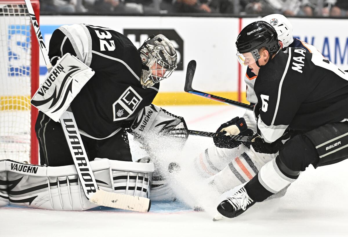 Kings goalie Jonathan Quick stops a shot by Edmonton Oilers forward Zach Hyman.