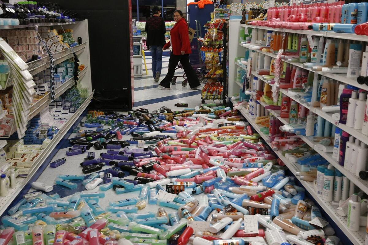 Shampoo and soap containers litter an aisle in the 99 Cent Only store on Imperial Highway in Brea after Friday's 5.1 earthquake.