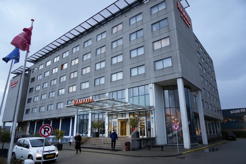 Exterior view of the hotel in Badhoevedorp near Schiphol Airport, Netherlands, where Dutch authorities have isolated 61 people who tested positive for COVID-19 on two arriving flights originating from South Africa, Saturday, Nov. 27, 2021. Authorities are carrying out further investigations to see if any of the travelers have the omicron variant. (AP Photo/Peter Dejong)