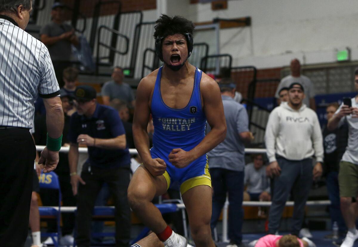 Fountain Valley's Hercules Windrath reacts after defeating Chaminade's Arvin Khosravy in overtime.