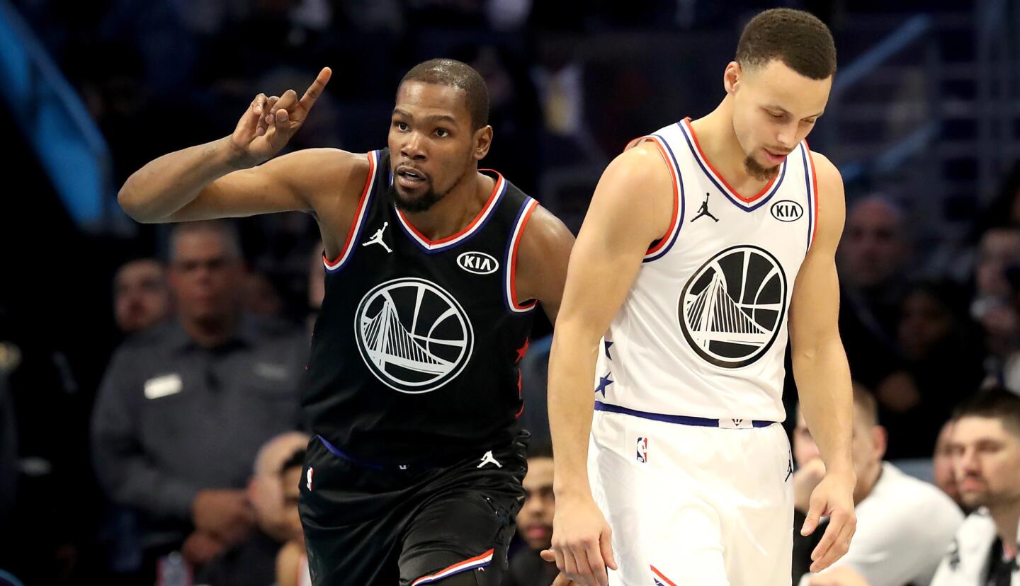 Kevin Durant of Team LeBron and Stephen Curry of Team Giannis have different reactions to a play during the NBA All-Star game.