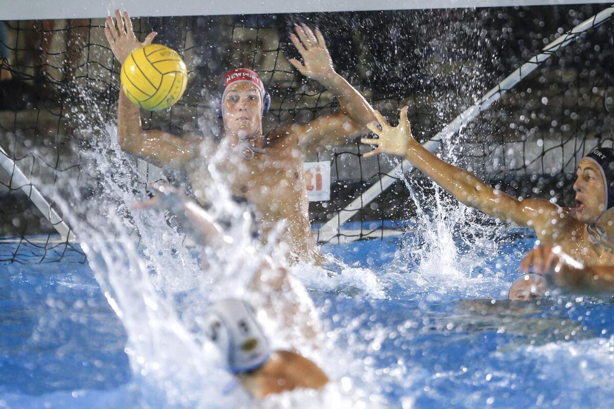 Newport Harbor goalie Luke Harris stops a long shot by CdM's Carson Simonsen (5) during Friday's match.