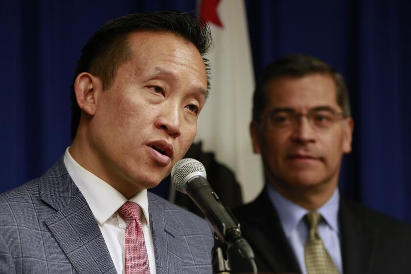 FILE - In this Feb. 13, 2018, file photo, Assemblyman David Chiu, D-San Francisco, left, speaks at a news conference in Sacramento, Calif. Chiu called on Gov. Gavin Newsom to appoint a member of the Asian and Pacific Islander community as California's next attorney general during a news conference on Wednesday, March 17, 2021. (AP Photo/Rich Pedroncelli, File)