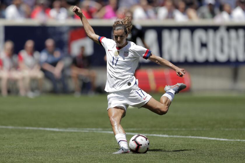 Unites States forward Tobin Heath shoots a scoring shot against Mexico during the first half of an international friendly soccer match, Sunday, May 26, 2019, in Harrison, N.J. (AP Photo/Julio Cortez)