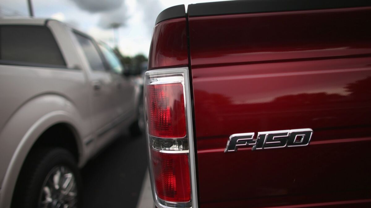 An F-150 pickup is seen at a car dealership in North Miami, Fla., on Sept. 4, 2013.