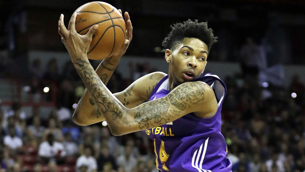 Brandon Ingram grabs a rebound for the Lakers during a summer league game against the Pelicans on July 8 in Las Vegas.