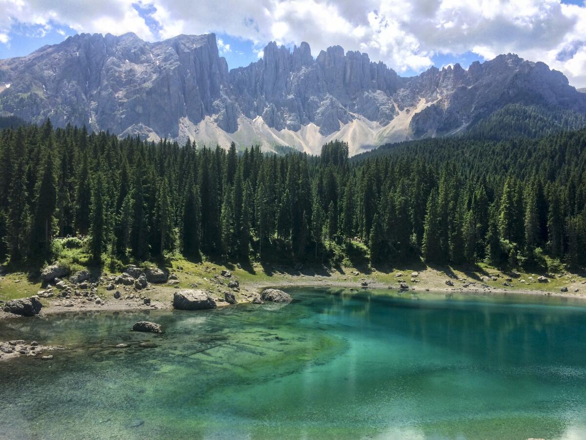 The iridescent water at Lago di Carezza, near Bolzano in the Italian Dolomites, makes this a popular roadside stop.