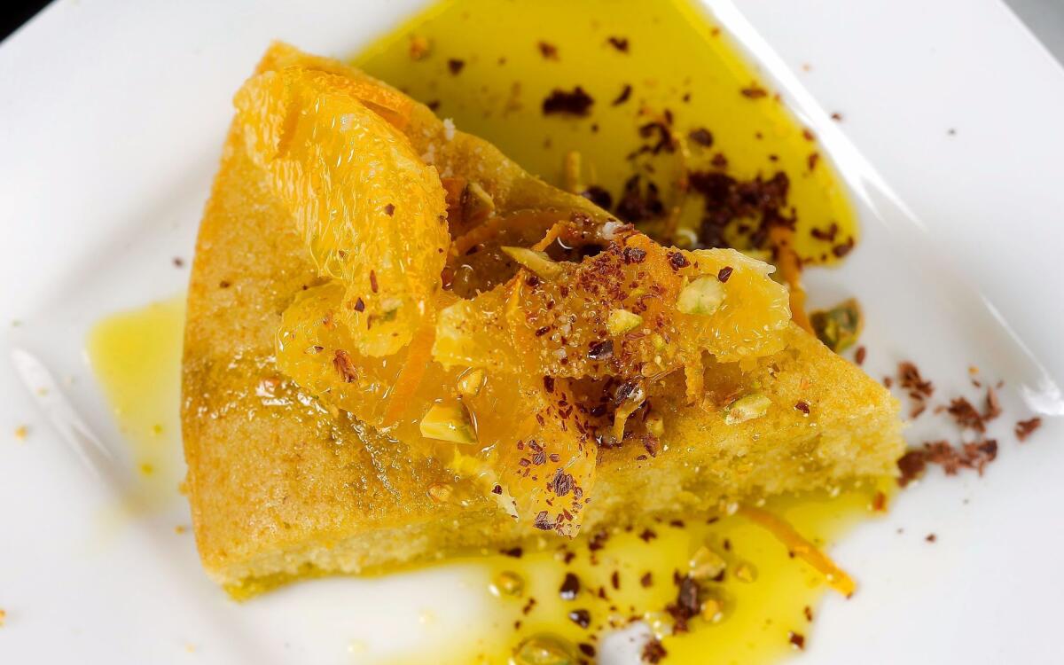 Orange and olive oil semolina cake with pistachios, chocolate and olio nuovo