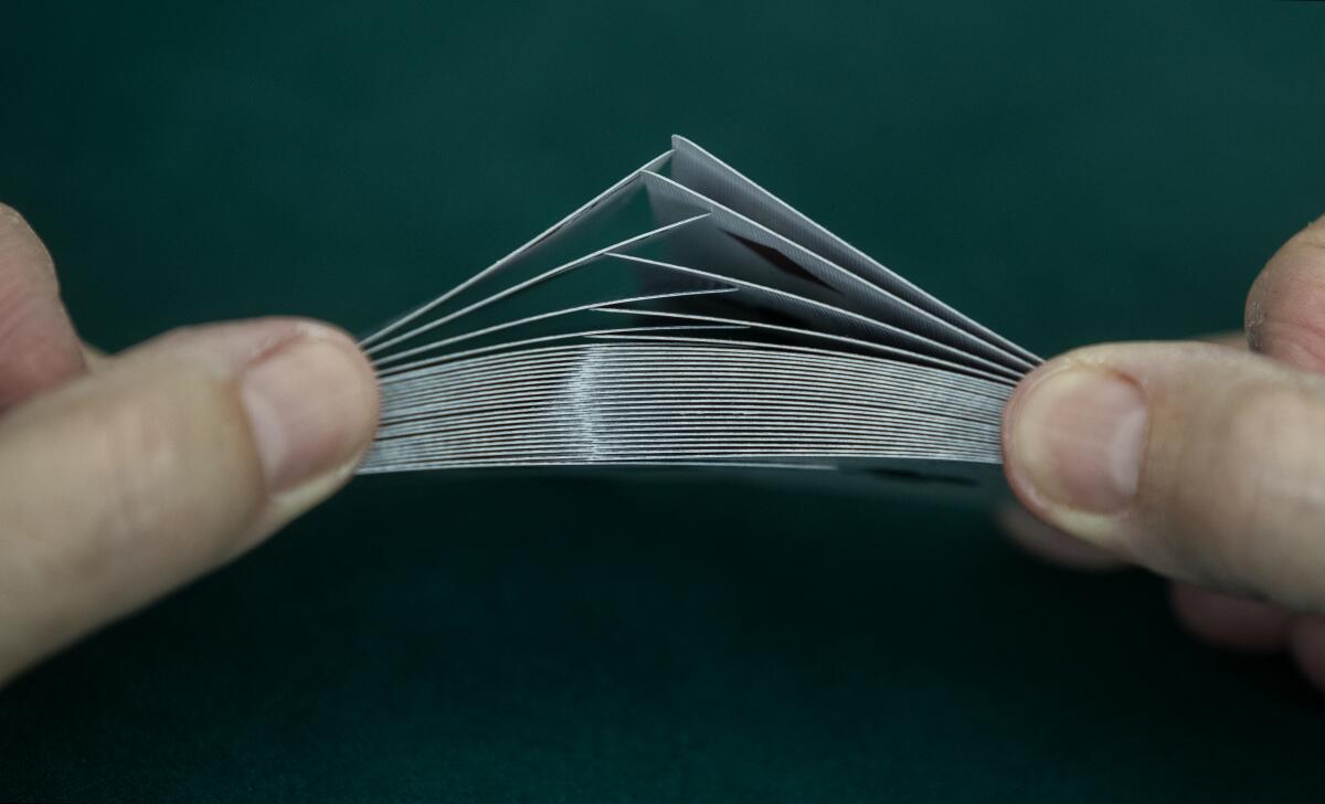  An up-close look at a deck of cards that Steve Forte is shuffling.