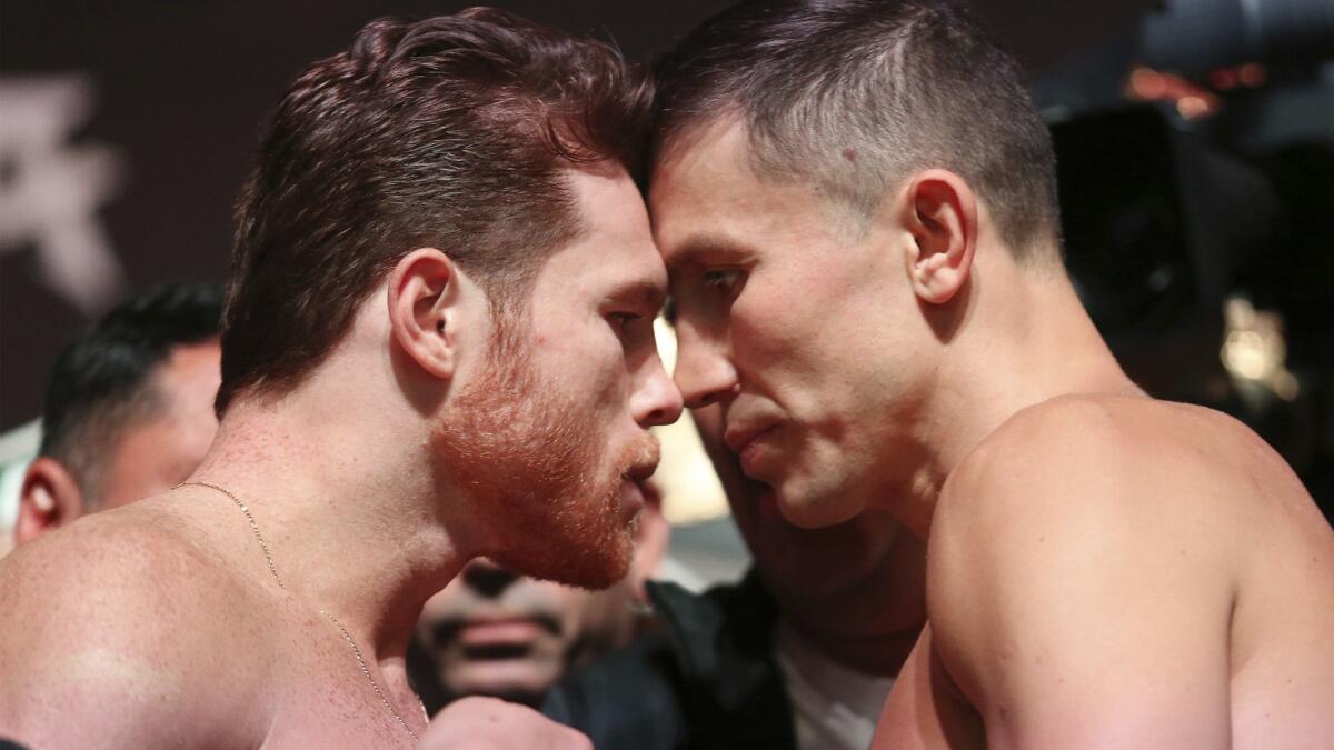 Canelo Alvarez, left, and Gennady Golovkin pose during a weigh-in Sept. 14 in Las Vegas.