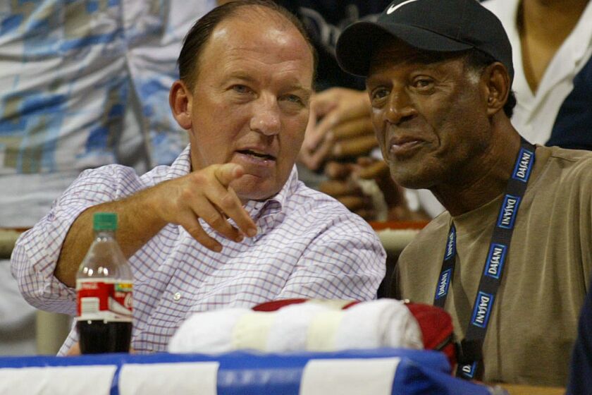 Clippers new coach Mike Dunleavy and Elgin Baylor at a summer league game against the Lakers and Clippers