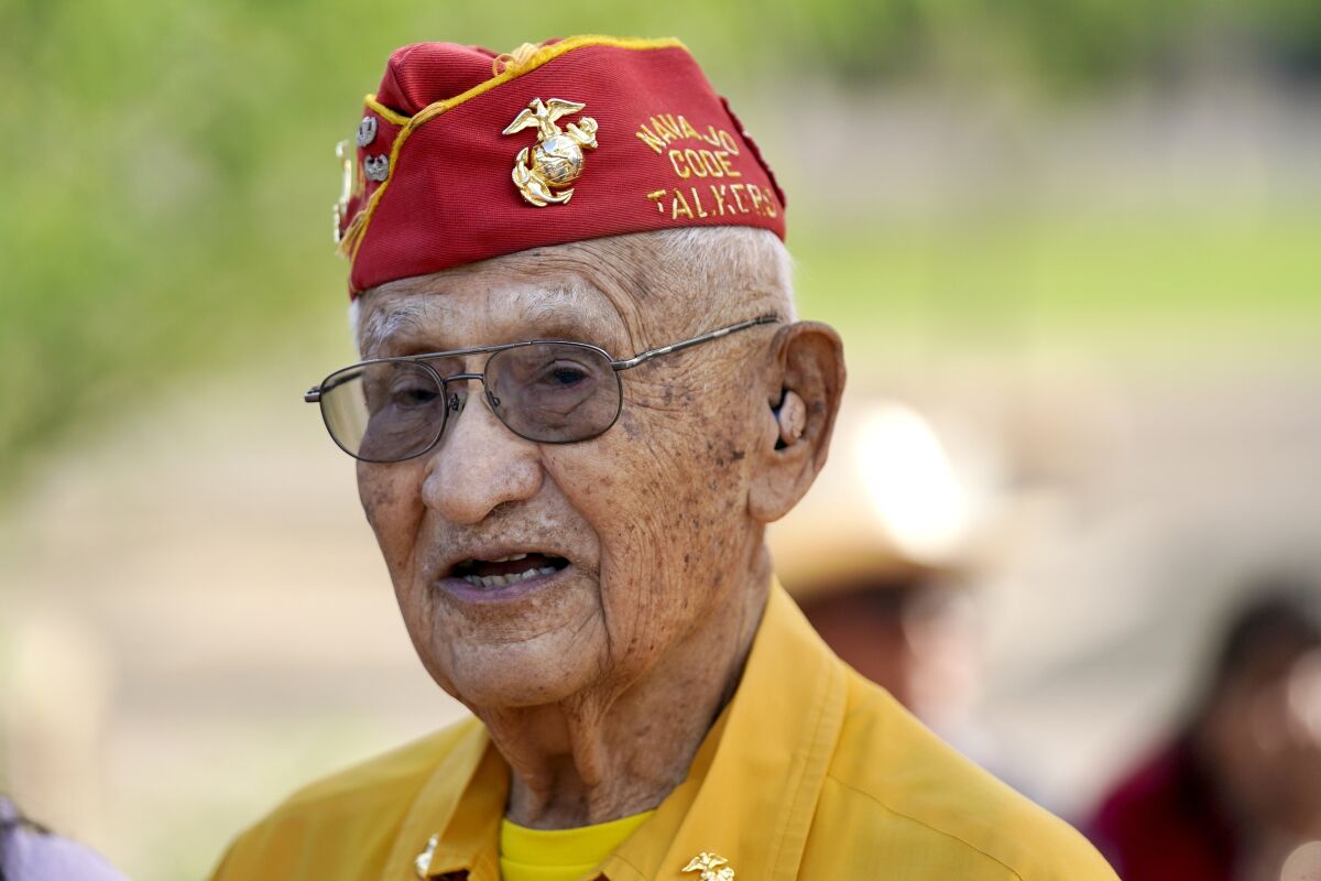 Navajo Code Talker Thomas Begay talks to people prior to the Arizona State Navajo Code Talkers Day celebration ceremony, Sunday, Aug. 14, 2022, in Phoenix. (AP Photo/Ross D. Franklin)