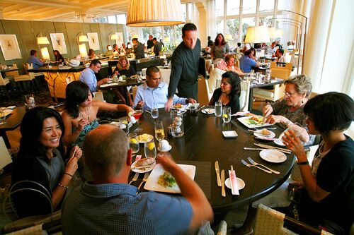 Tall windows fill Catch's large dining room with natural light. Servers are professional and relaxed.