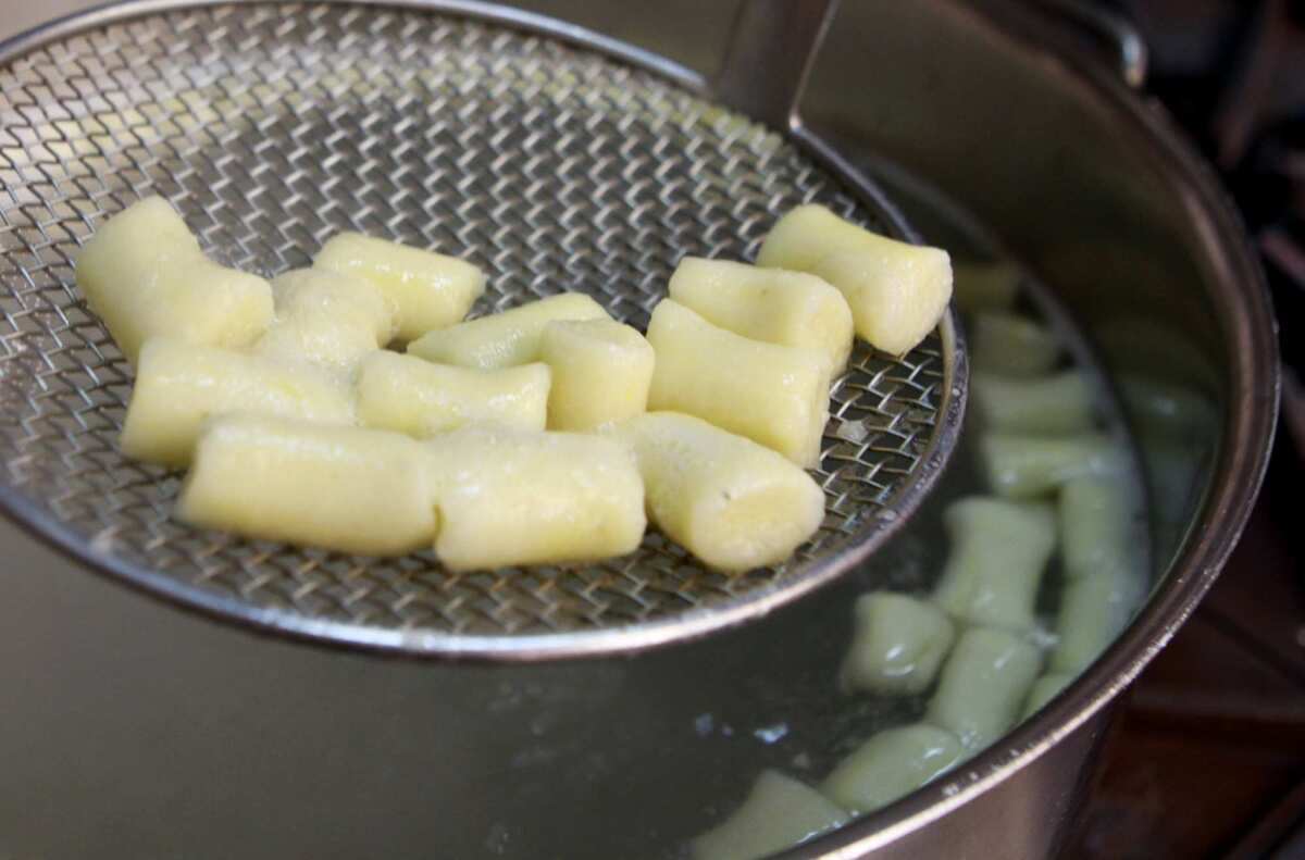 Chef John Keenan at the Craft restaurant in Los Angeles prepares gnocchi in the kitchen.