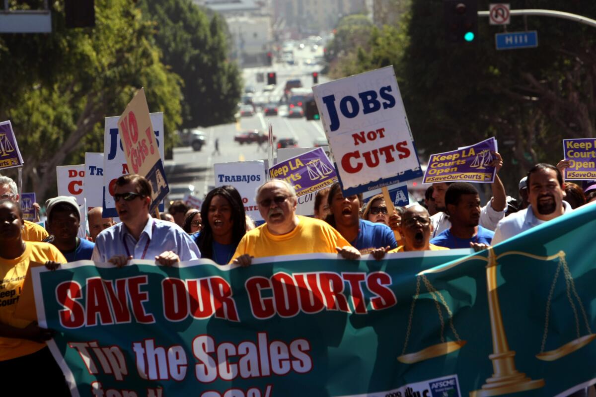 Protesters march in 2013 to oppose the closure of courthouses in Los Angeles County.