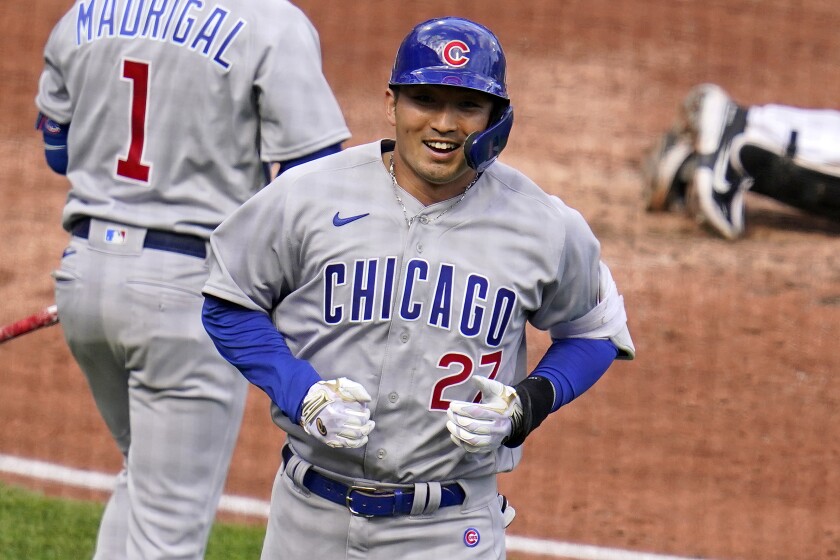 Chicago Cubs' Seiya Suzuki (27) heads back to the dugout after hitting a solo home run off Pittsburgh Pirates starting pitcher Jose Quintana during the fifth inning of a baseball game in Pittsburgh, Tuesday, April 12, 2022. (AP Photo/Gene J. Puskar)