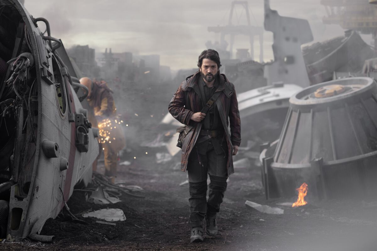 a man walking through rubble