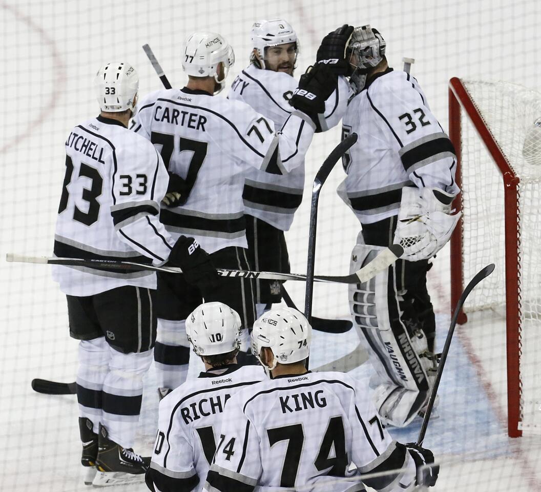 Kings players celebrate with Jonathan Quick