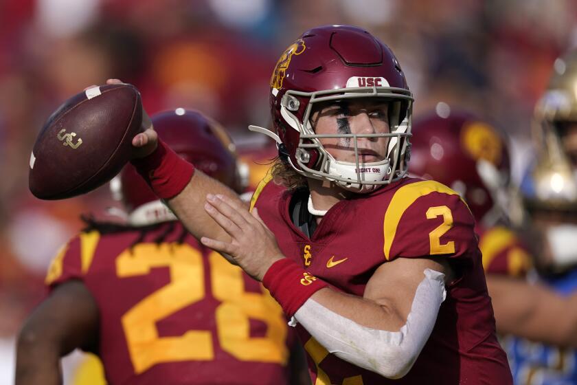 Southern California quarterback Jaxson Dart passes during the first half of an NCAA college football game against UCLA