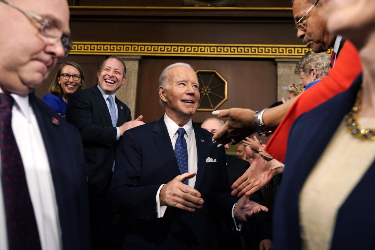 President Biden greats members of Congress as he arrives at the Capitol to deliver his State of the Union address on Feb. 7. 
