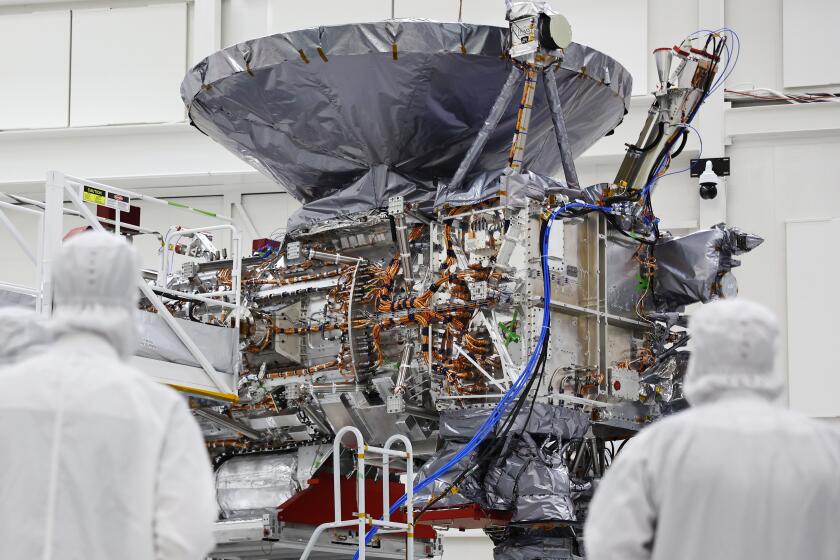PASADENA, CALIFORNIA - APRIL 11: The NASA Europa Clipper spacecraft is viewed inside a Spacecraft Assembly Facility clean room at NASA's Jet Propulsion Laboratory (JPL) on April 11, 2024 in Pasadena, California. The spacecraft is scheduled to investigate and perform flybys of Europa, Jupiter's moon, where data suggests a global ocean of water lies beneath the icy surface which may be habitable for life. The spacecraft is scheduled to launch from NASA’s Kennedy Space Center in Florida in October. (Photo by Mario Tama/Getty Images)