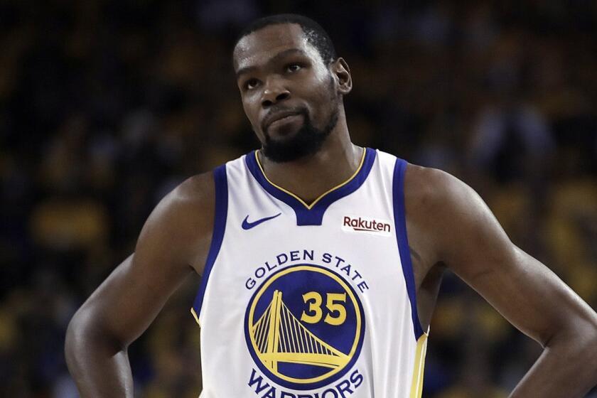 Golden State Warriors' Kevin Durant, left, walks away from referee Ken Mauer during the first half of Game 5 of the team's second-round NBA basketball playoff series against the Houston Rockets on Wednesday, May 8, 2019, in Oakland, Calif. (AP Photo/Ben Margot)