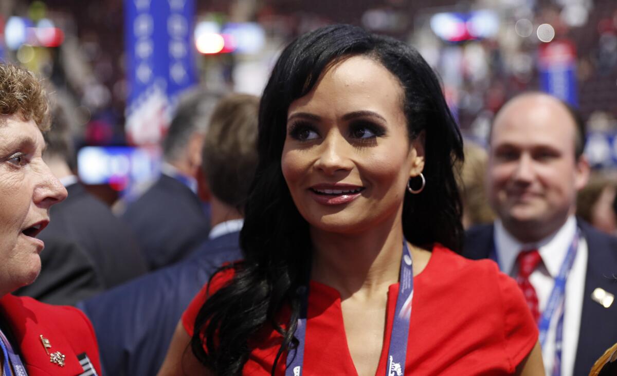 Donald Trump spokeswoman Katrina Pierson talks with delegates on the convention floor during the final day of the Republican National Convention in Cleveland on July 21, 2016.