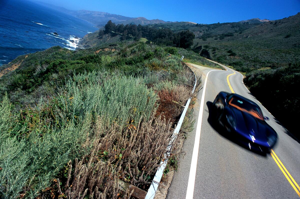 A Corvette speeds along the California coast 