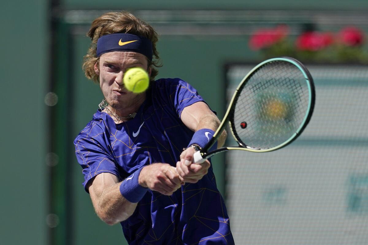 Andrey Rublev returns a shot to Grigor Dimitrov at the BNP Paribas Open on Friday.
