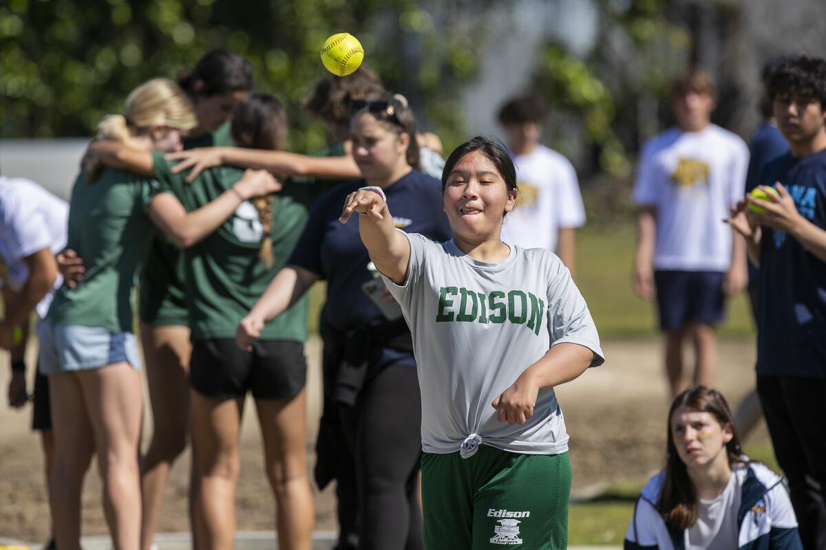 Edison's Michelle Tlapa-Morales throws a softball during the Unified Sports track meet on Thursday.